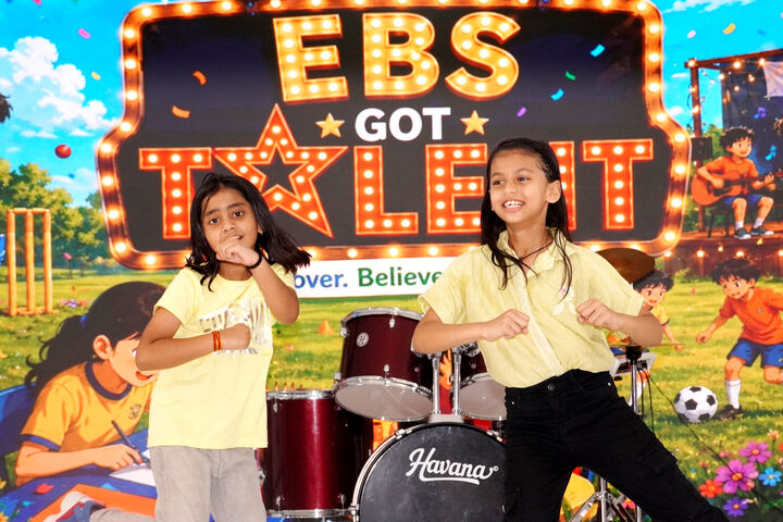 Two students dancing on stage at EBS Got Talent