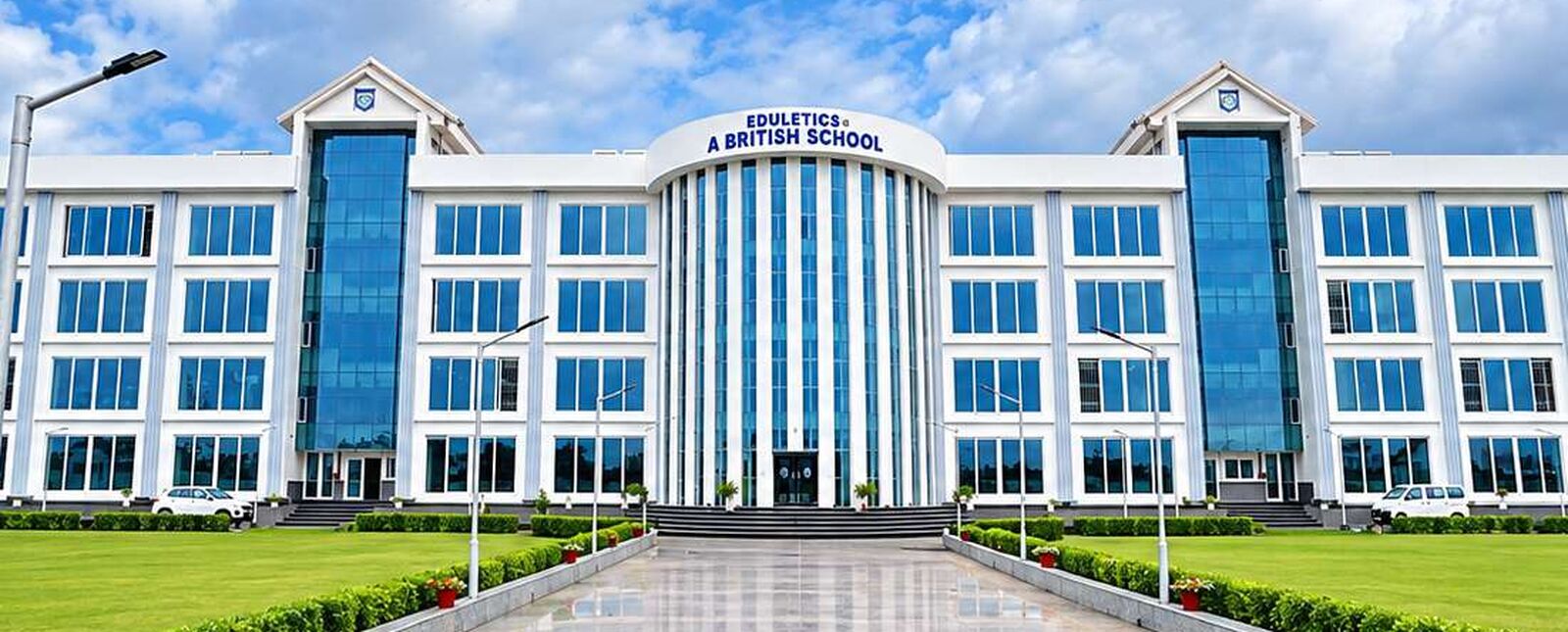 Front view of Eduletics International A British School in Sukulpur, Patna, with the entrance, lawns and walkway